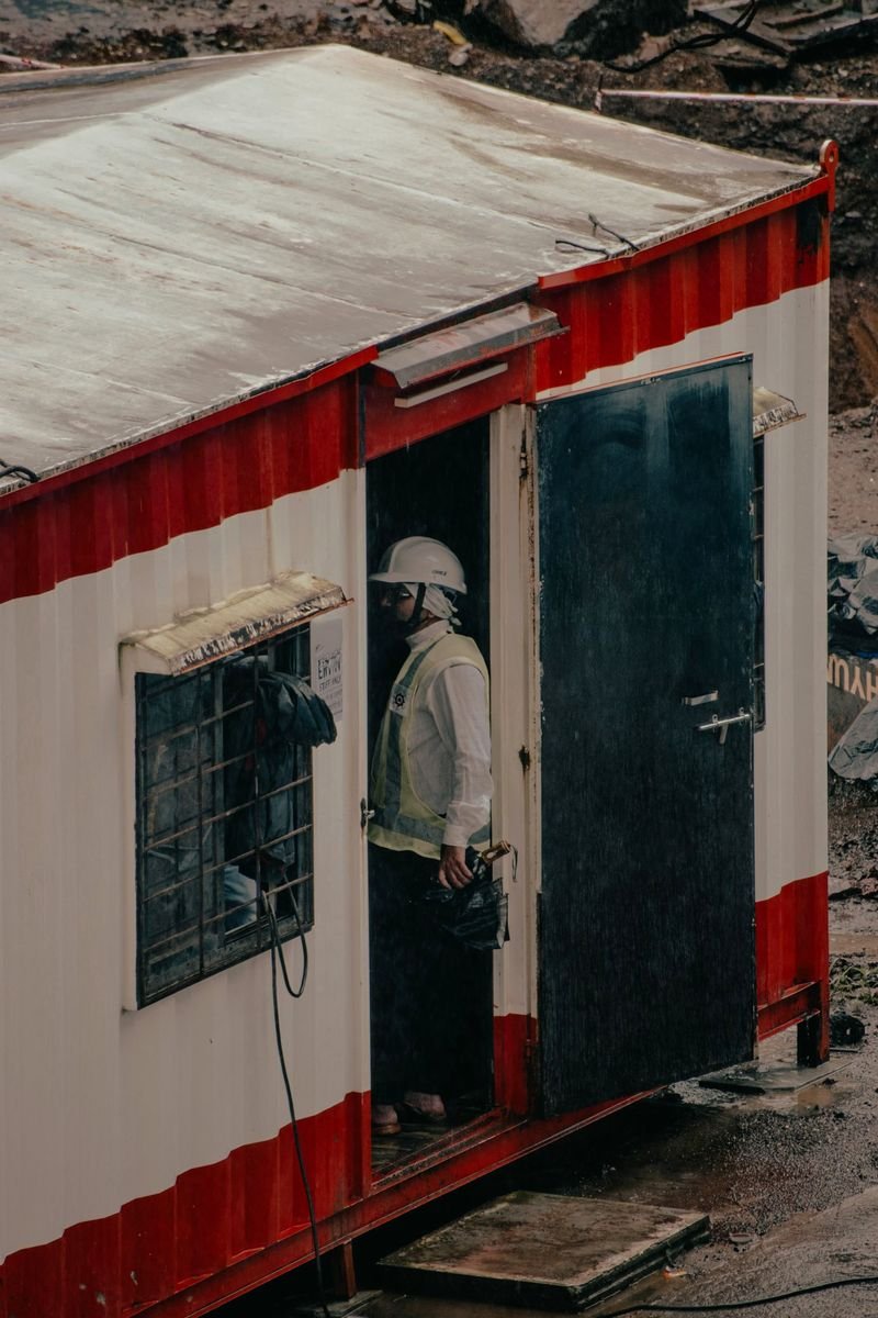 Worker leaving a site office cabin