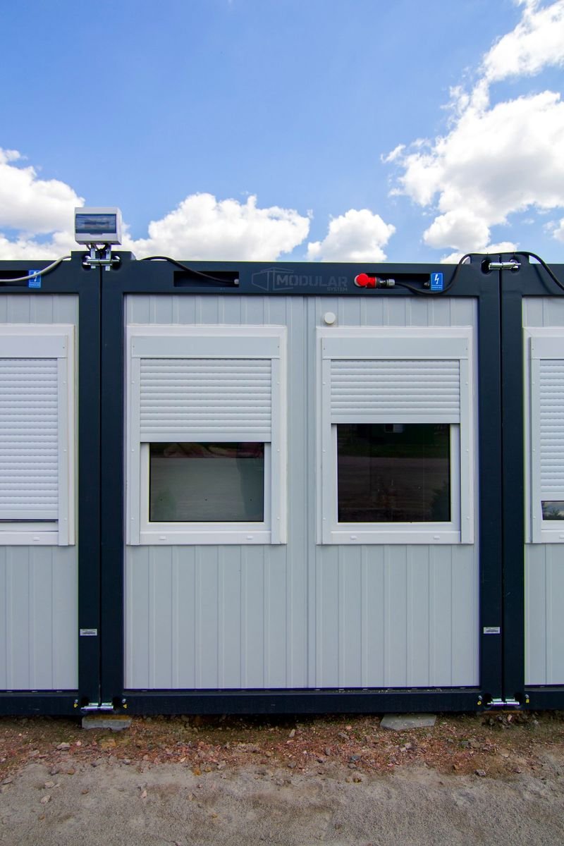 Modular site office unit with shuttered windows