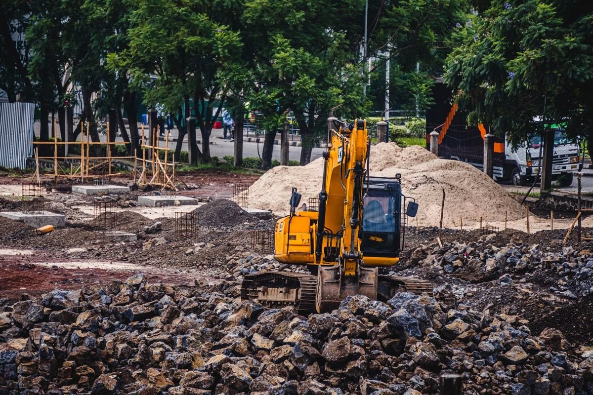 Excavator working on an urban construction site