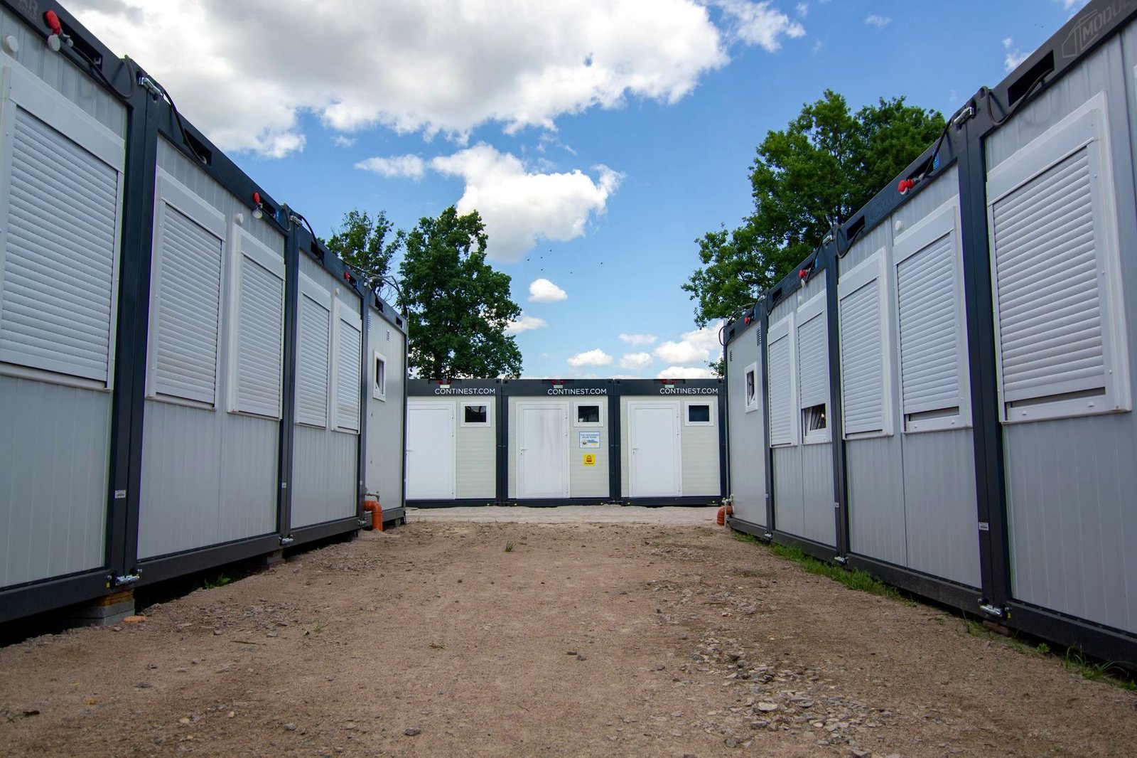 Rows of modular accommodation cabins at a site camp