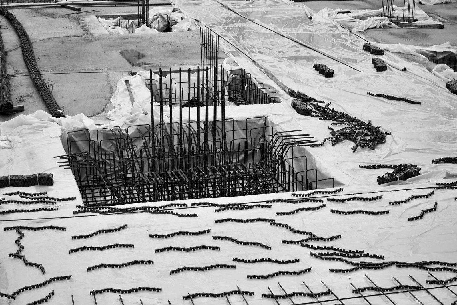 Aerial view of a large construction site with reinforcement framework